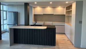 modern kitchen renovation with black countertops and shelves | GPS: 49.347589, -123.039533